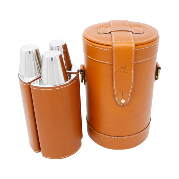 a tan leather triple decanter bar set by Marlborough of England