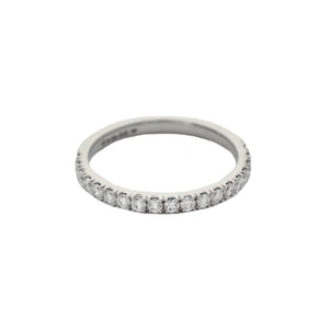 A nineteen stone diamond half eternity ring in platinum. The round diamonds are four claw set