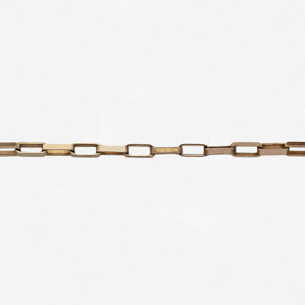 yellow rectangular paper link chain in the centre of a white background