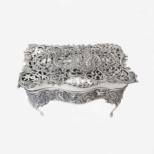 silver openwork trinket box with leaf pattern