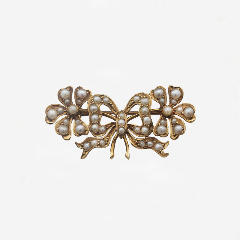 gold ribbon bow brooch with seed pearls