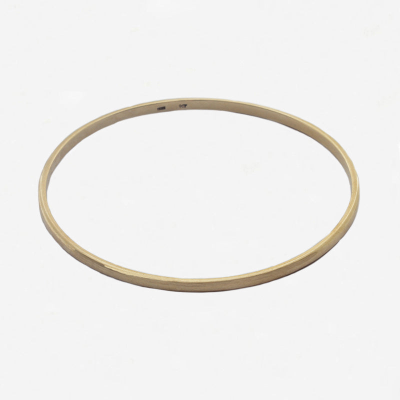 yellow plain bangle on white background