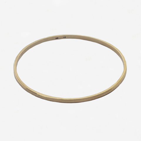 yellow plain bangle on white background