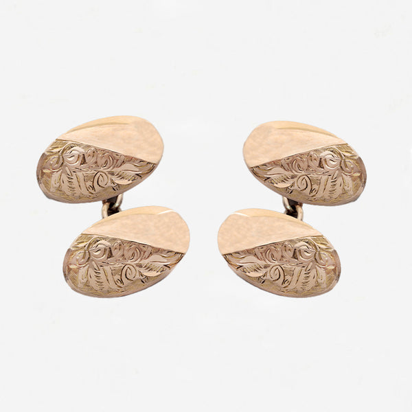 Set of gold cufflinks with intricate designs on a white background rose