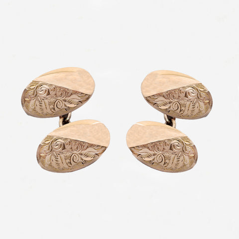 Set of gold cufflinks with intricate designs on a white background rose