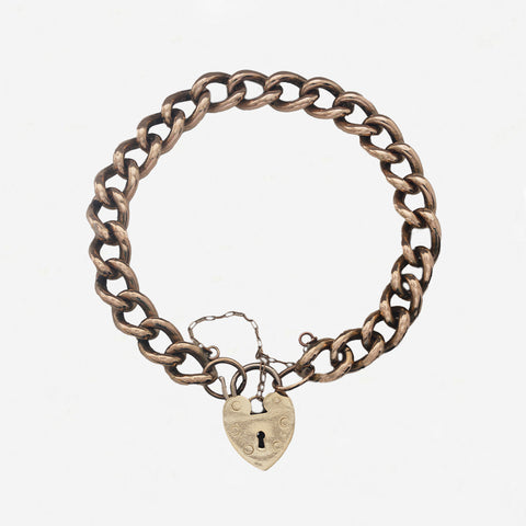 a preowned curb link charm bracelet