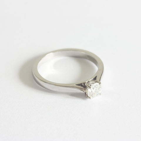 a certificated diamond solitaire engagement ring with 4 claws