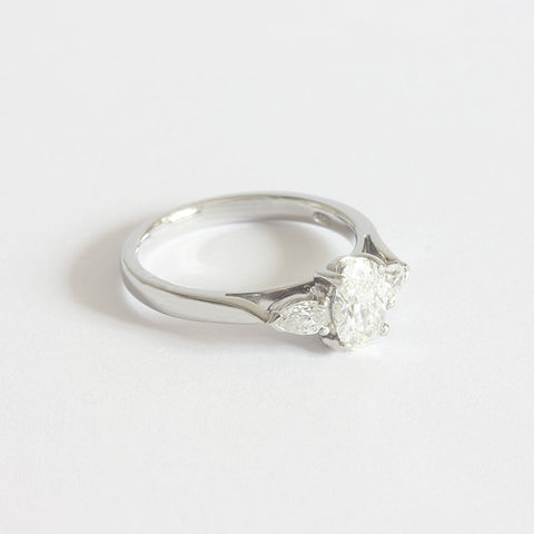 an oval and pear shape 3 stone ring diamond set in platinum
