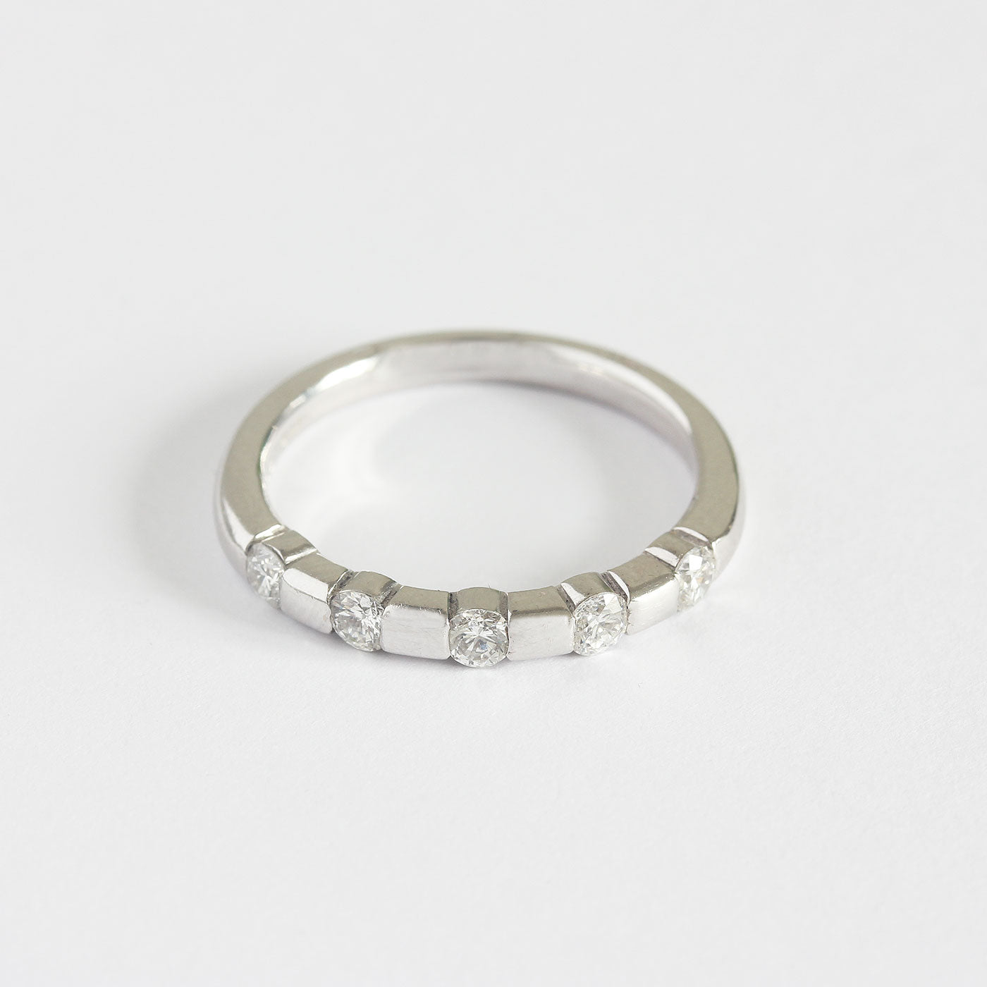 a modern 5 stone round diamond ring in white gold