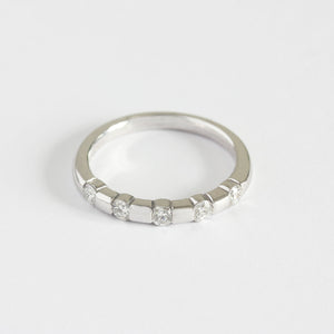 a modern 5 stone round diamond ring in white gold