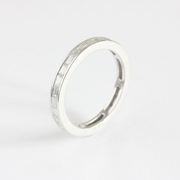 a contemporary white gold eternity ring with baguette cut diamonds