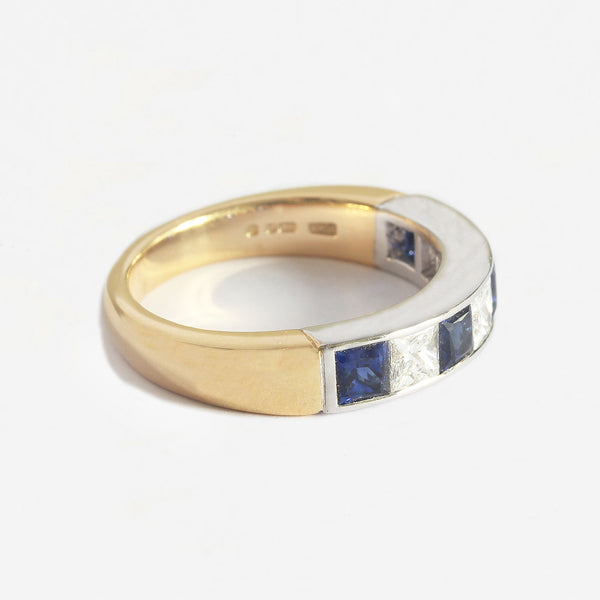 a yellow and white gold half eternity ring with square sapphires and diamonds 7 stones