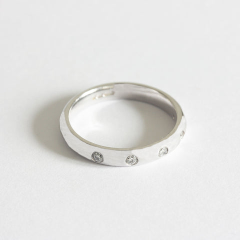 a white gold modern diamond set 5 stone ring