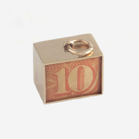 a vintage 10 shilling note charm in gold case with jump ring