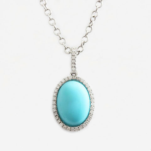an oval turquoise and diamond cluster pendant necklace white gold