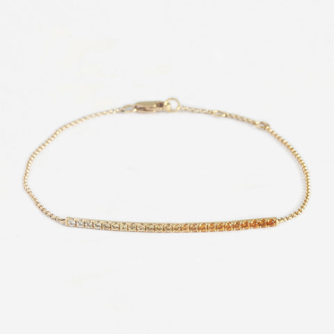 a sapphire yellow and orange bracelet in yellow gold