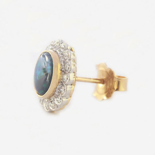 a pair of opal and diamond stud earrings in yellow and white gold
