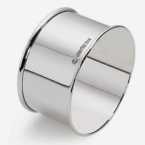 a plain sterling silver polished napkin ring with clear hallmark and grooved edge