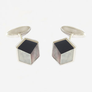 a sterling silver pair of cufflinks with onyx and mother of pearl in a 3d shape