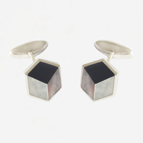 a sterling silver pair of cufflinks with onyx and mother of pearl in a 3d shape