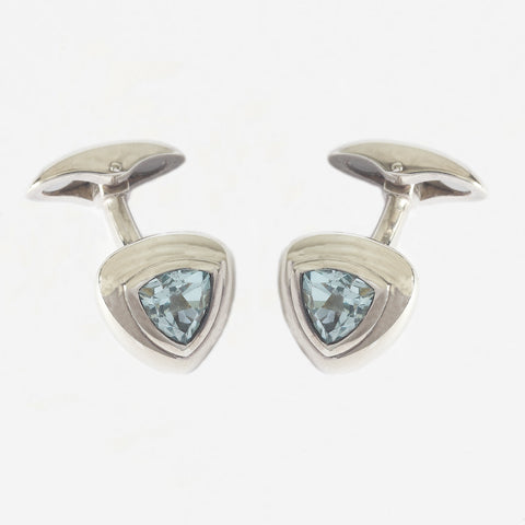 a pair of sterling silver triangular shaped blue topaz cufflinks with bar connectors