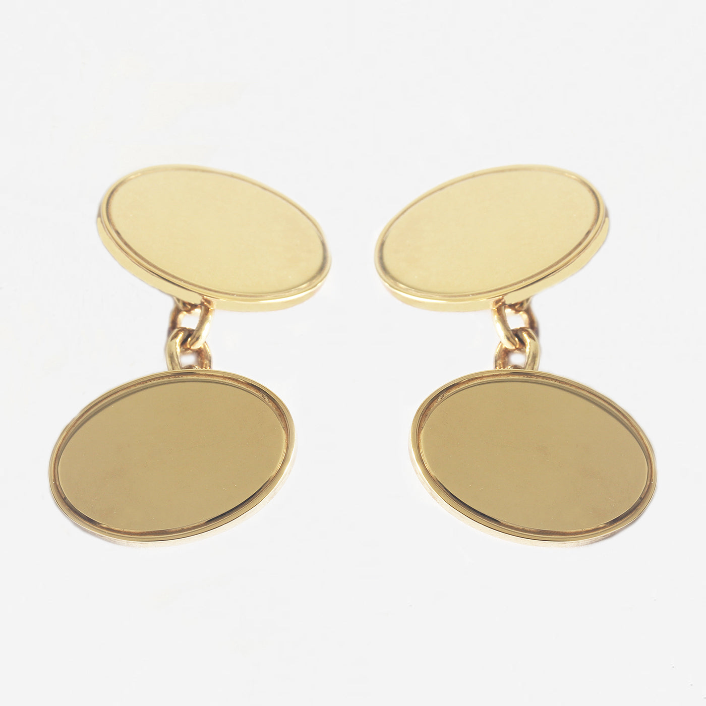 a pair of gold plated on silver oval plain cufflinks with chain connectors