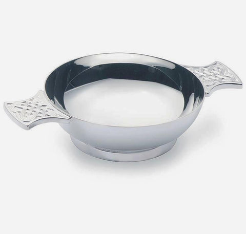 a modern sterling silver quaich with a celtic pattern with a full hallmark