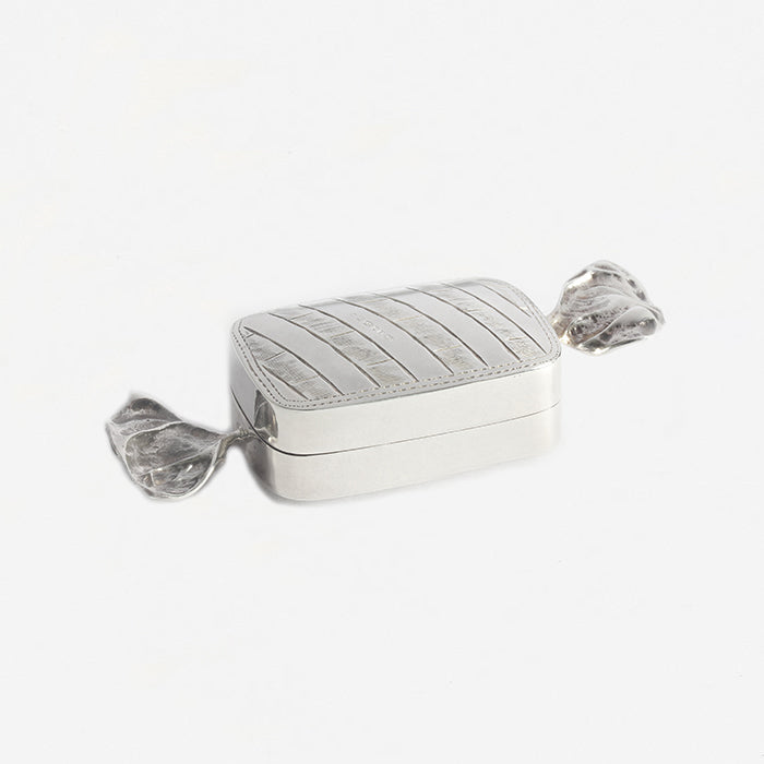 a silver pill box sweet design shape with full hallmark