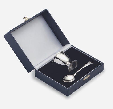 a solid sterling silver egg cup and spoon for a child in a presentation box 