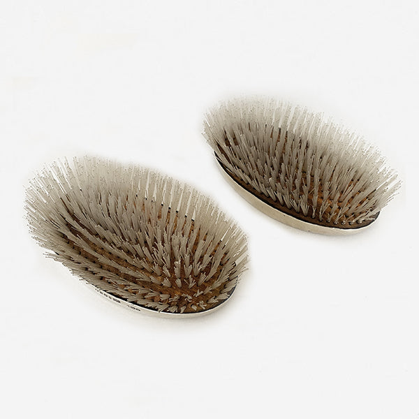 a pair of silver gents hairbrushes dated 1935