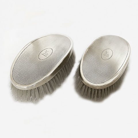 a silver pair of hairbrushes dated birmingham 1935