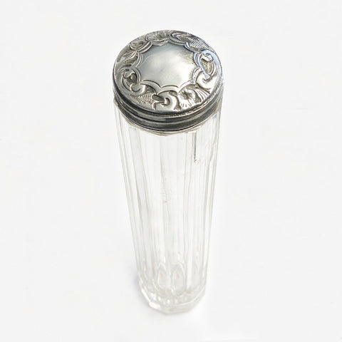 a silver and glass hatpin bottle dated 1898