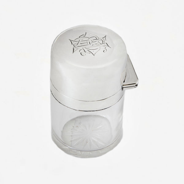 an Edwardian perfume bottle with engraving and stopper dated 1909