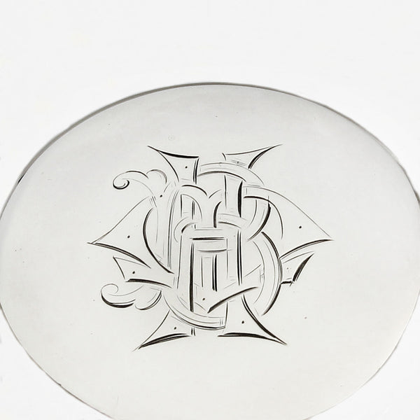 an Edwardian silver and glass perfume bottle with engraved initials and dated 1909