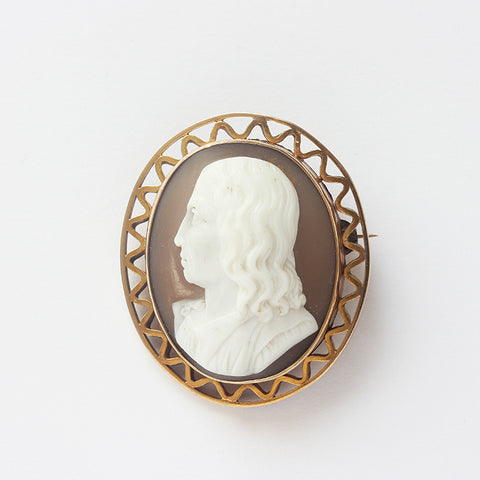a cameo secondhand brooch with a man profile in yellow gold border