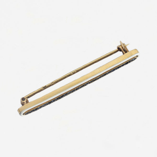 a secondhand yellow gold square sapphire and white enamel bar brooch 