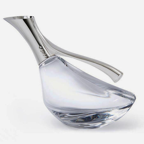 a wine jug in the shape of a duck with a sterling silver top and glass base modern and excellent quality