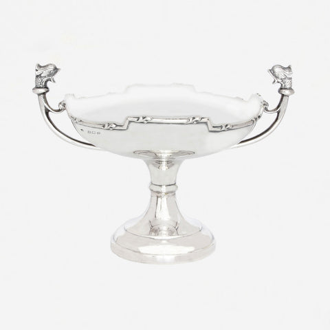 a silver dish dated 1913 fish head handles