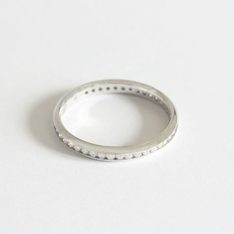 A full eternity ring with forty three round diamonds channel set in platinum