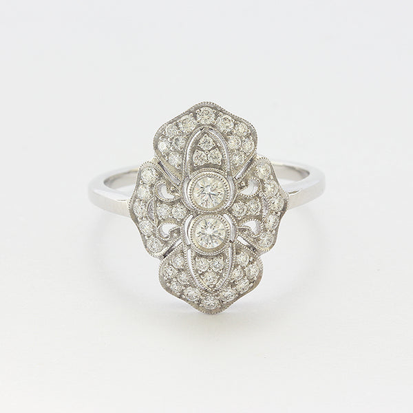 Front view of a Diamond cluster Art deco style ring in 18ct white gold with a grain setting edge