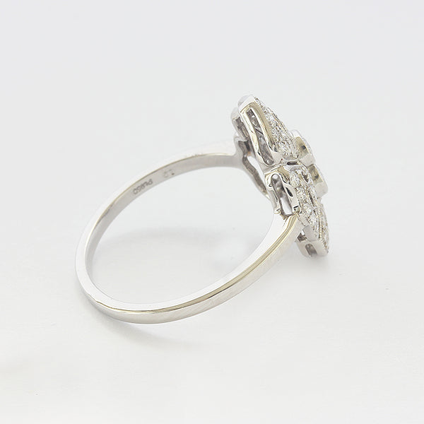 Side view of a Diamond cluster Art deco style ring in 18ct white gold with a grain setting edge