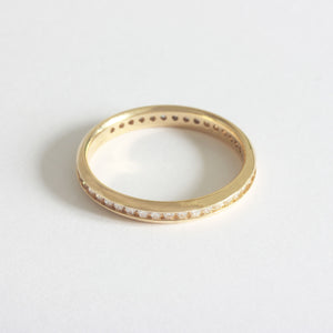 A forty two stone diamond full eternity ring in 18ct yellow gold. The stones are modern briiliant cut in a channel setting