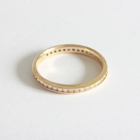 A forty two stone diamond full eternity ring in 18ct yellow gold. The stones are modern briiliant cut in a channel setting