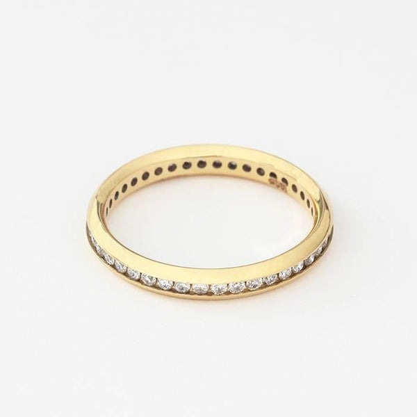 A forty two stone diamond ring set in yellow gold. The round brilliant cut diamonds are channel set