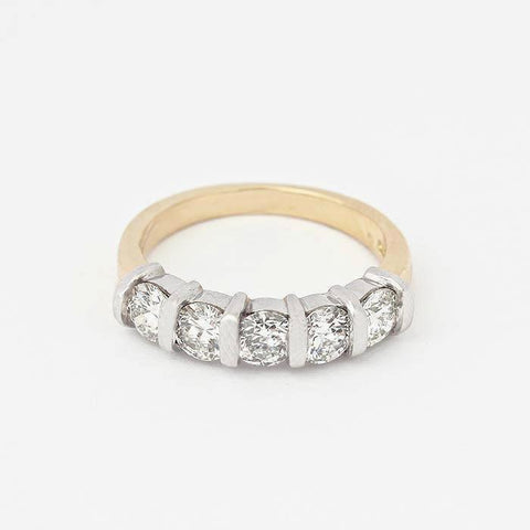 Diamond half eternity ring with 5 round stones in a white gold bar setting with a yellow band