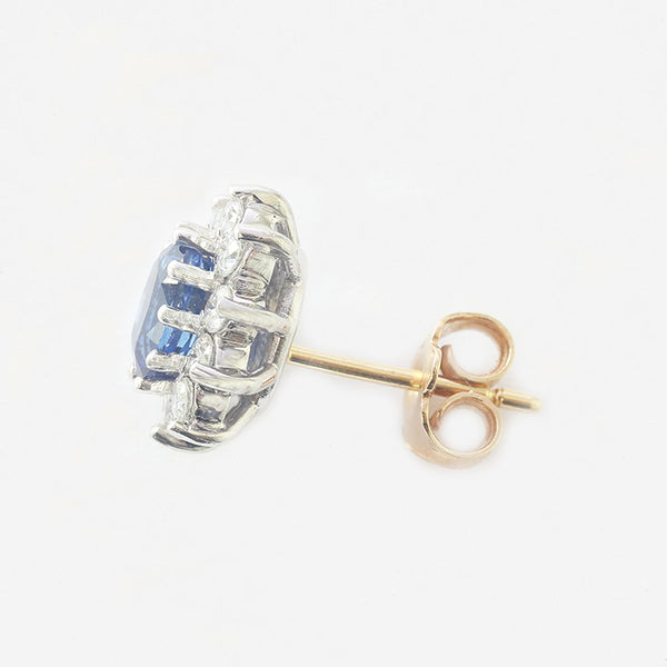 a pair of modern oval claw set sapphire and diamond cluster stud earrings