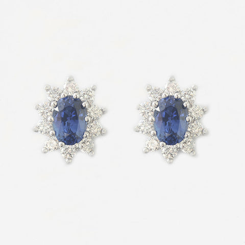 oval claw set modern blue sapphire and diamond cluster stud earrings in white and yellow gold