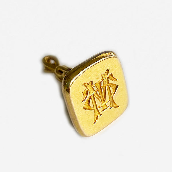 a preowned gold old seal fob with initials dated 1911