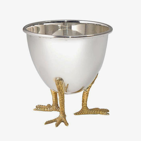 a sterling silver egg cup with chicken feet in a gilt finish by francis howard in sheffield