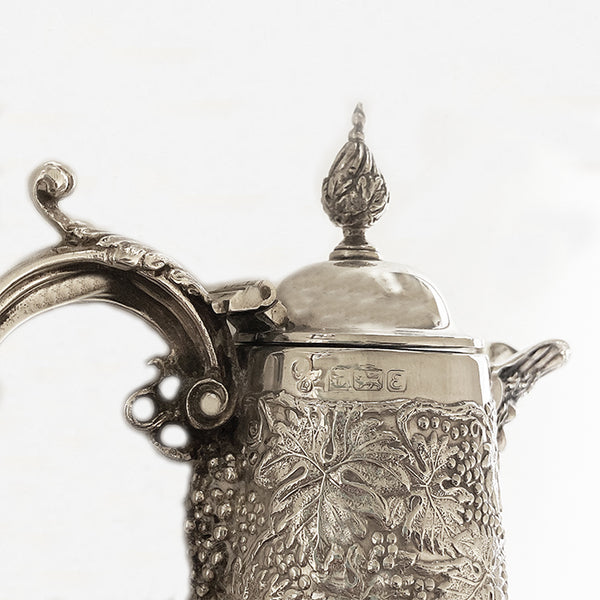 a beautiful silver and glass claret jug ornate leaf design dated 1979